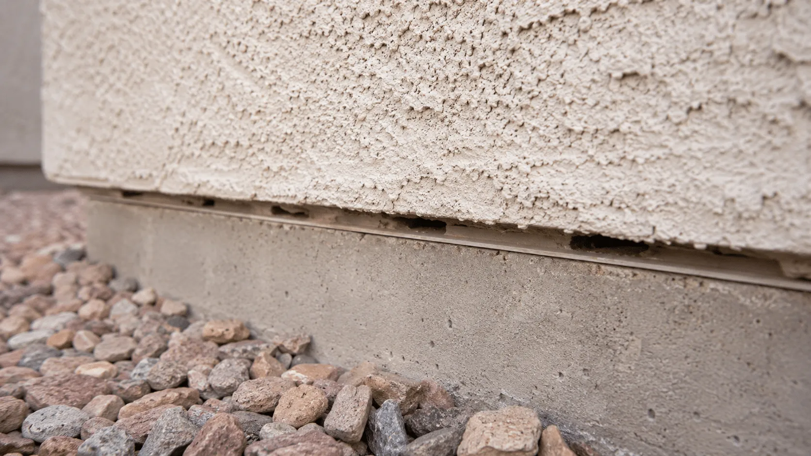 Close-up of scorpion barrier gaps showing Arizona summer survival pathways