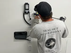 Technician performing Systemic Sealing for scorpion prevention