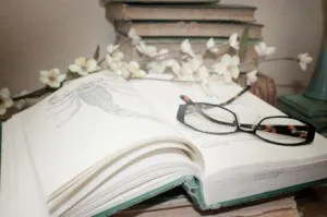 White lavender flowers beside a scorpion prevention book